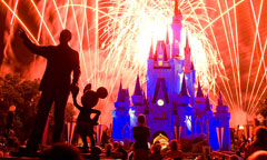 Walt Disney, Mickey and Cinderella’s castles light up by the light of the fireworks from the Wishes show at the Magic Kingdom.